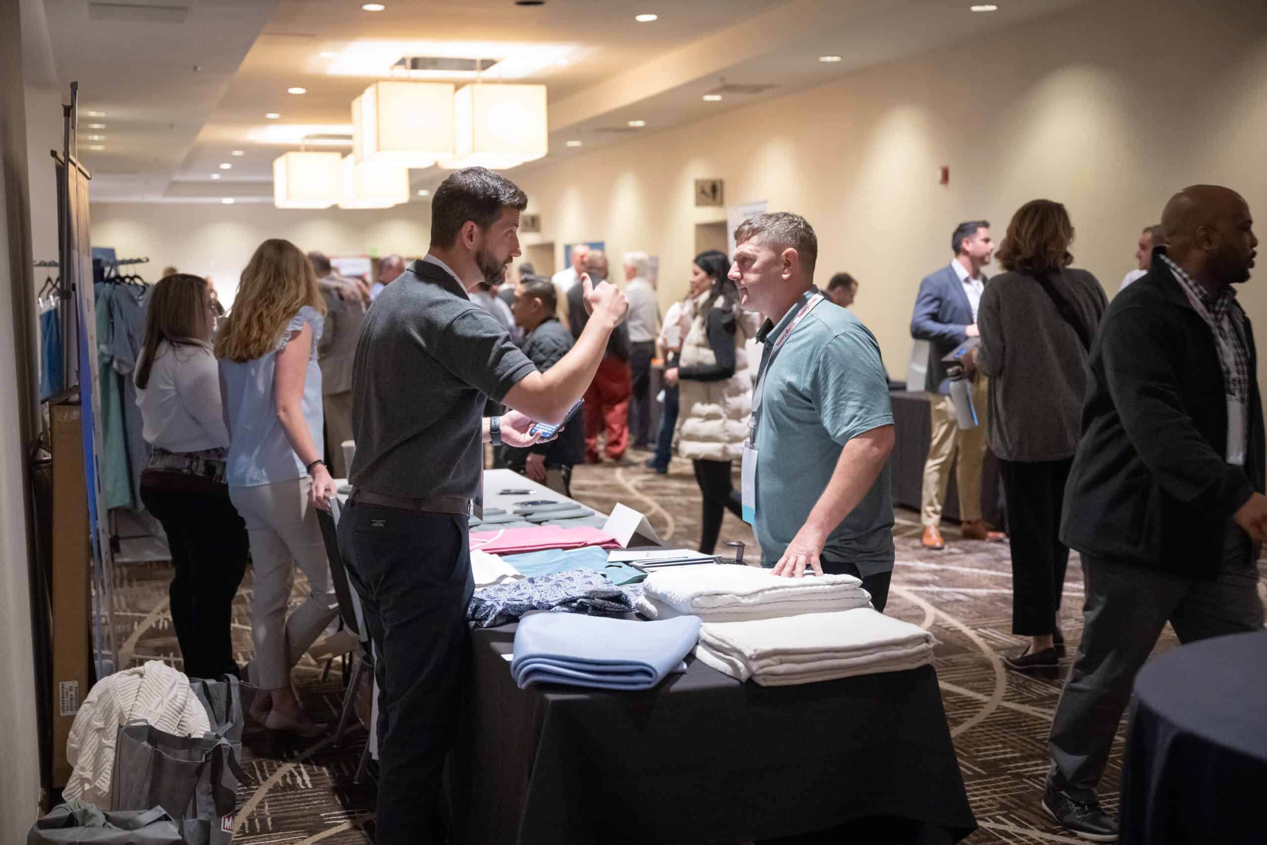 Sponsor tabletop booth at the 2024 IMPACT Conference 